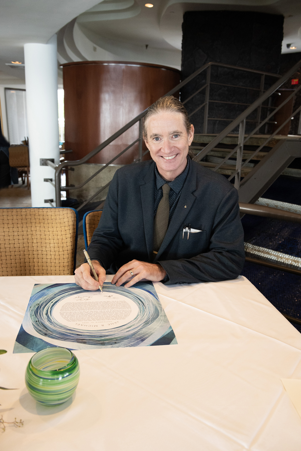 Rev. Michael Signing a Ketubah