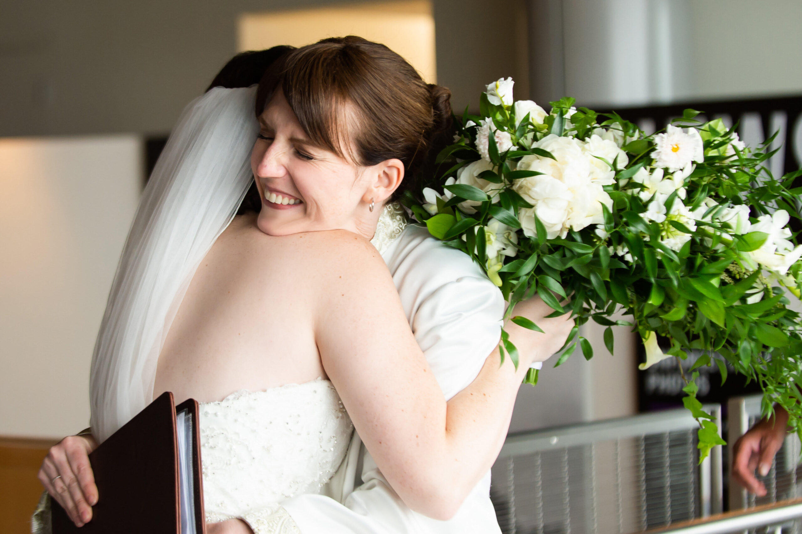 Rev. Laura Cannon hugging a bride in Maryland